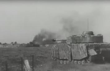 Advancing Mark IV Panzer crushing through fence, note the armoured skirts, Schürzen, for added protection (Still from Battlefield-The Battle for Caen)