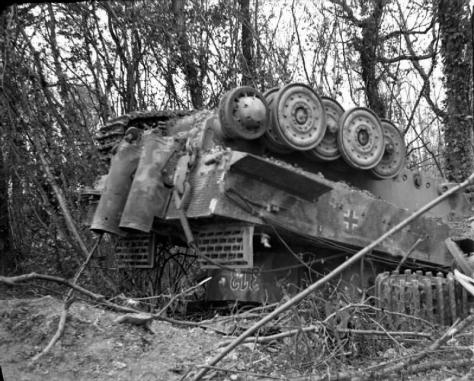 Despite its 56-ton weight, this Tiger I of 3./s.Pz.Abt. 503 (3rd Company 503rd Heavy Tank Battalion) was overturned at Manneville by the bombing. Three men survived.[110]By Connolly (Sgt), No 5 Army Film & Photographic Unit [Public domain], via Wikimedia Commons